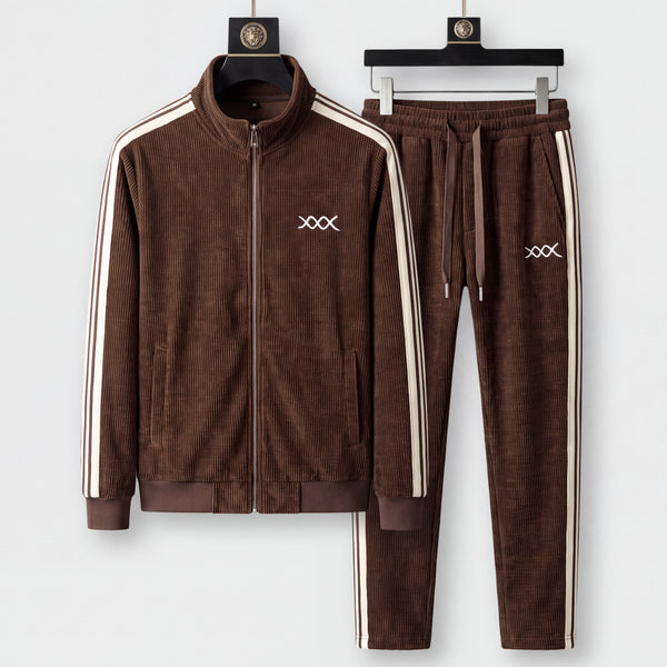 Urbino ribbed tracksuit in walnut brown with cream stripes, jacket and joggers on black hangers against a light grey studio background