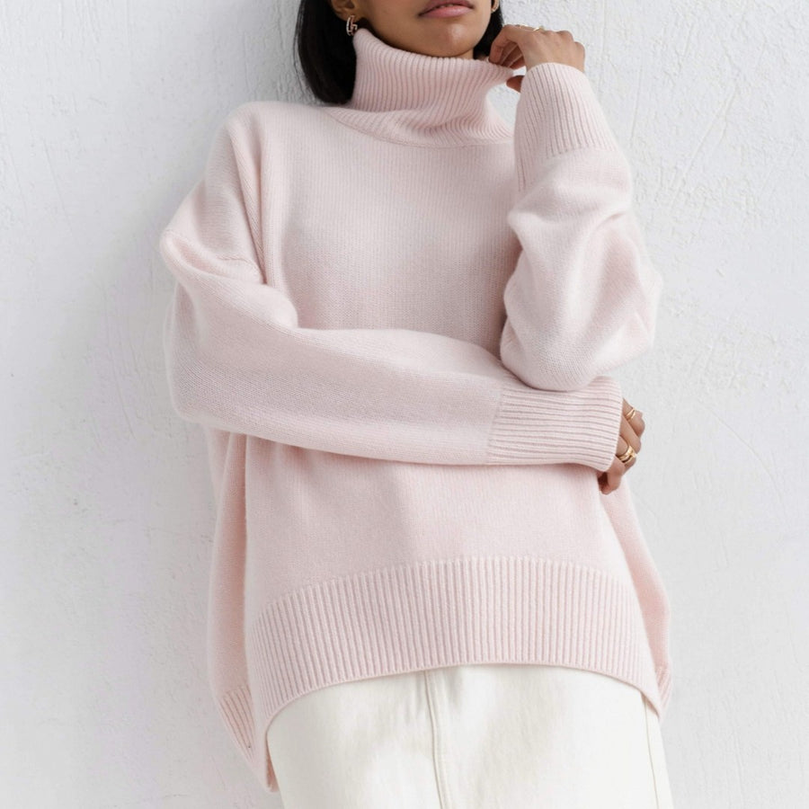 Lydia turtleneck sweater in light pink, relaxed fit over white trousers